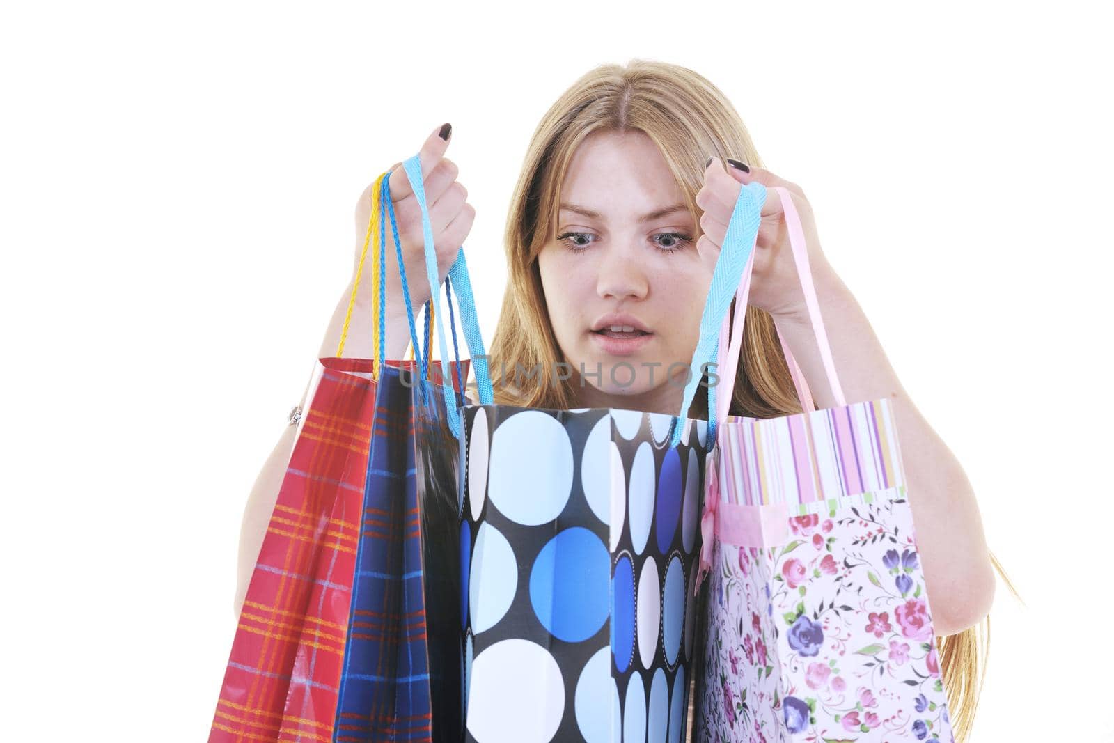 happy young adult women  shopping with colored bags  isolated over white background in studio