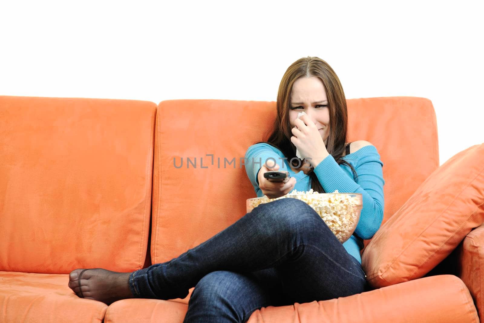 young woman eat popcorn, watching movies and eat popcor isolated on white