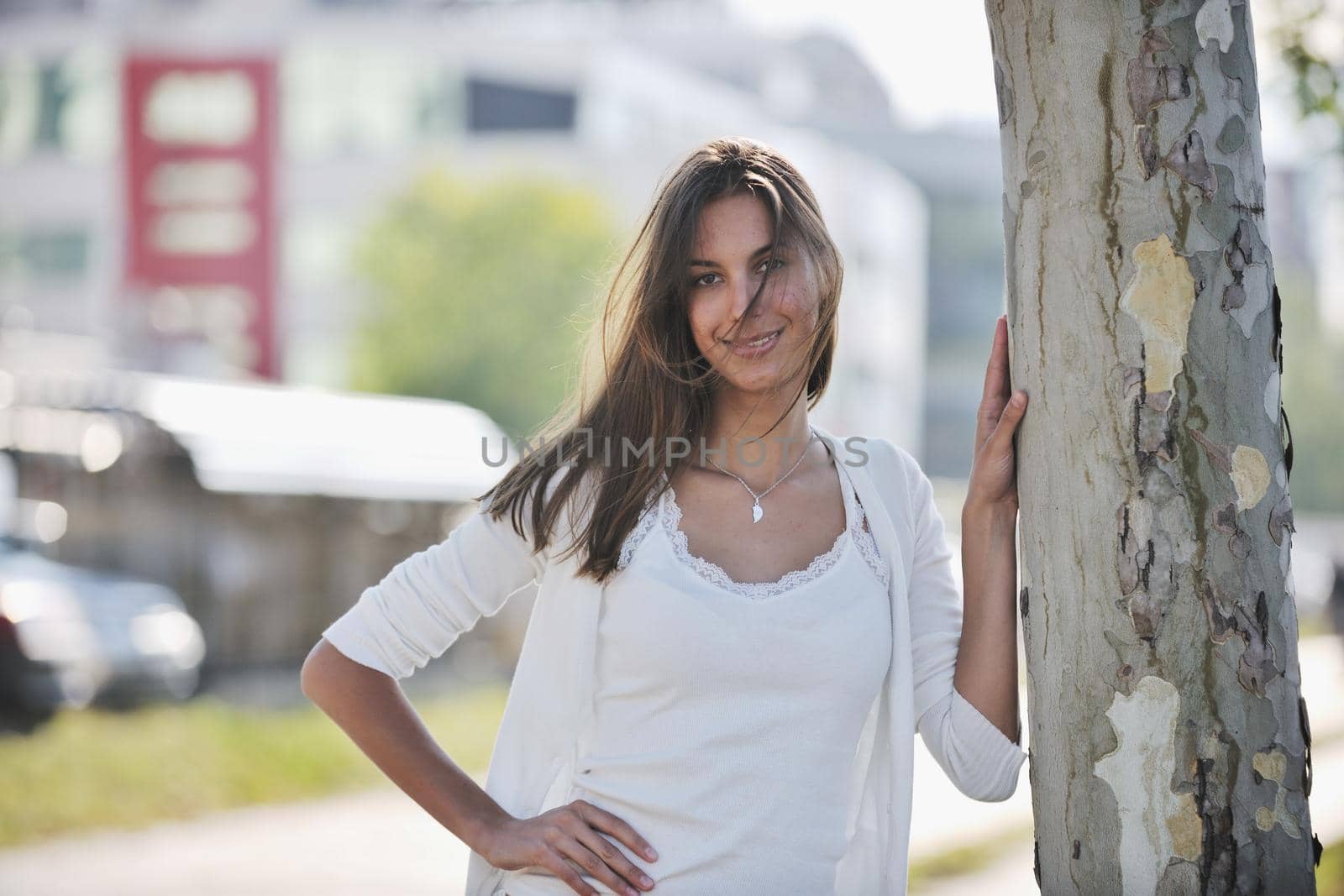 beautiful young woman have fun and relax at city street on beautiful sunny day