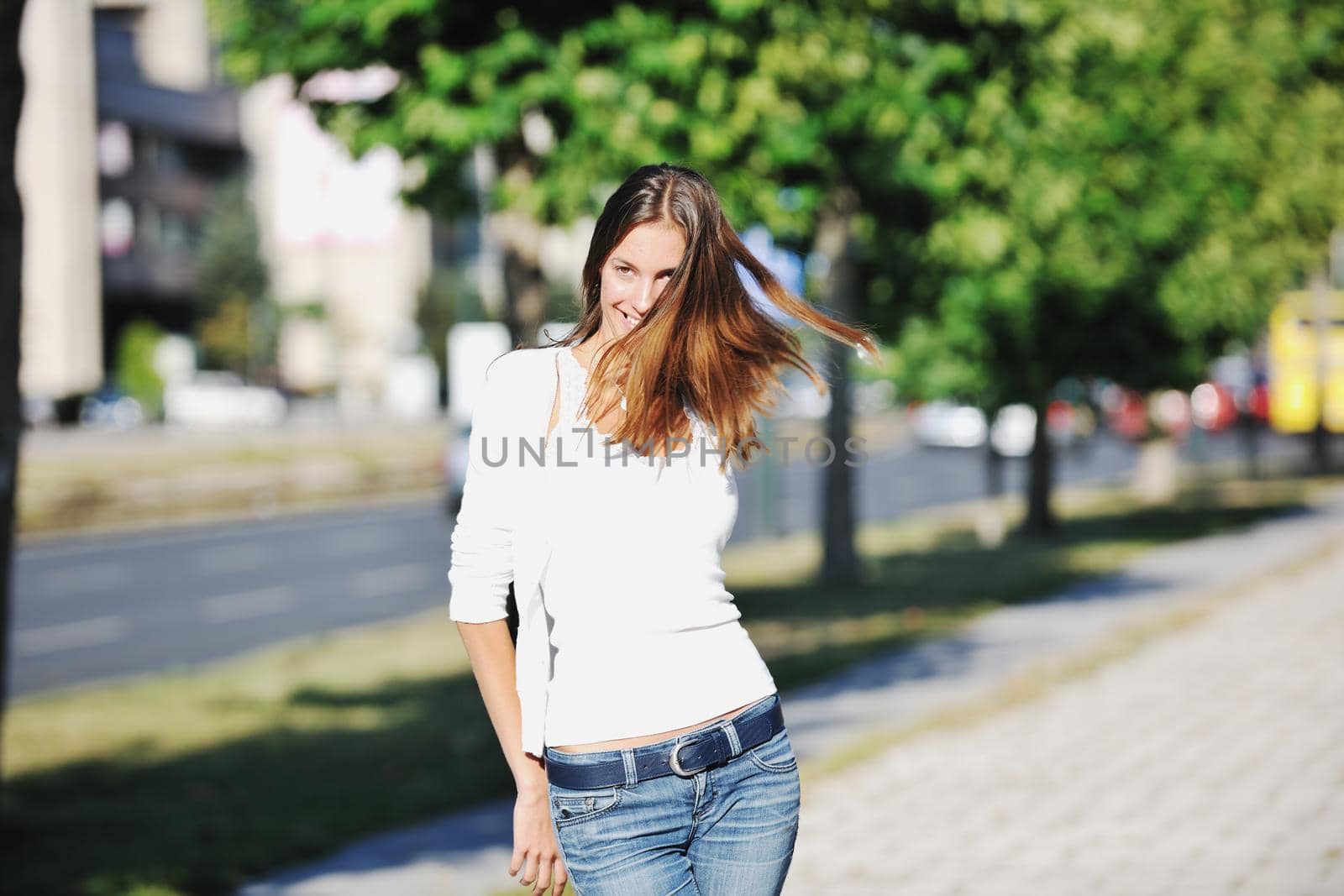 beautiful young woman have fun and relax at city street on beautiful sunny day