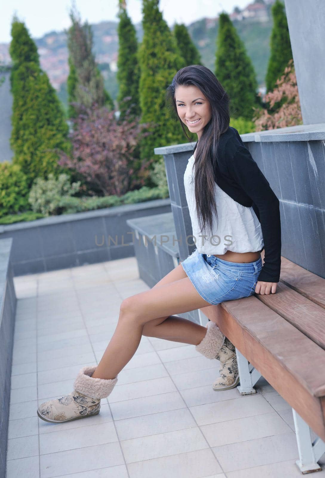 beautiful young woman lady posing in green moden outdoor garden