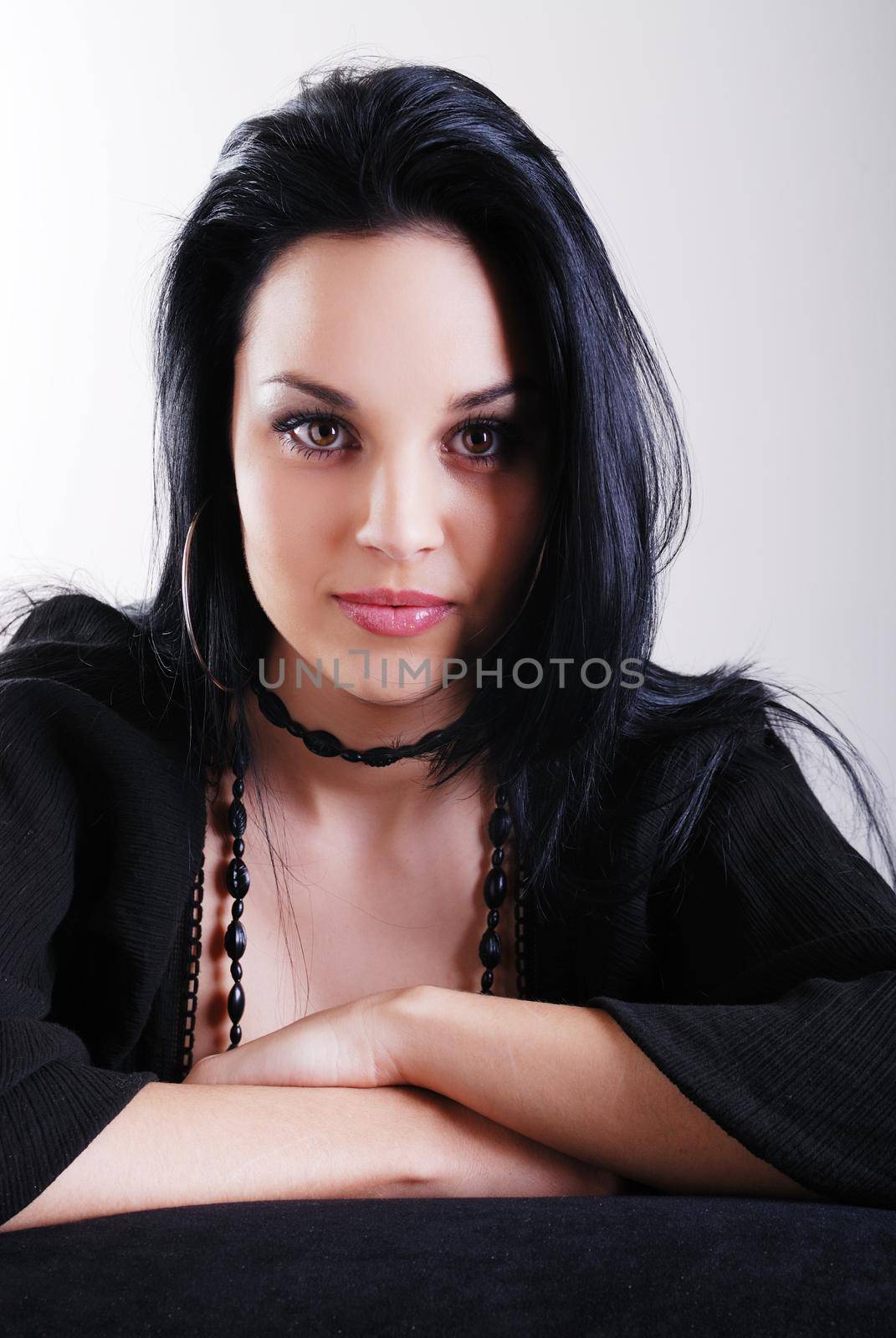 one brunette woman posing in studio 