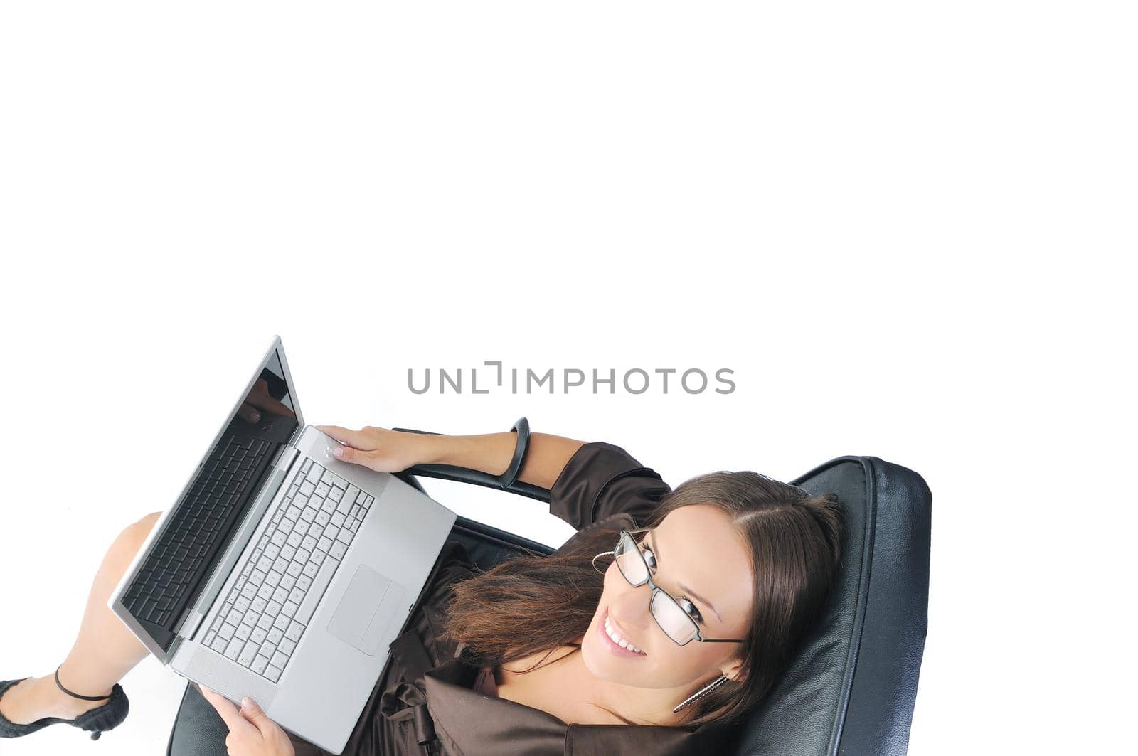 young beautiful business woman isolated on white workling on laptop computer