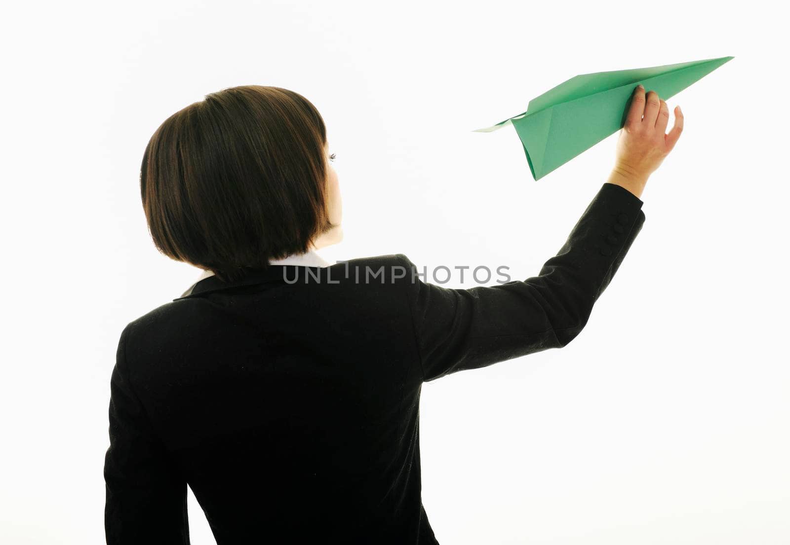 happy young business woman isolated ona white throwing paper airplane 