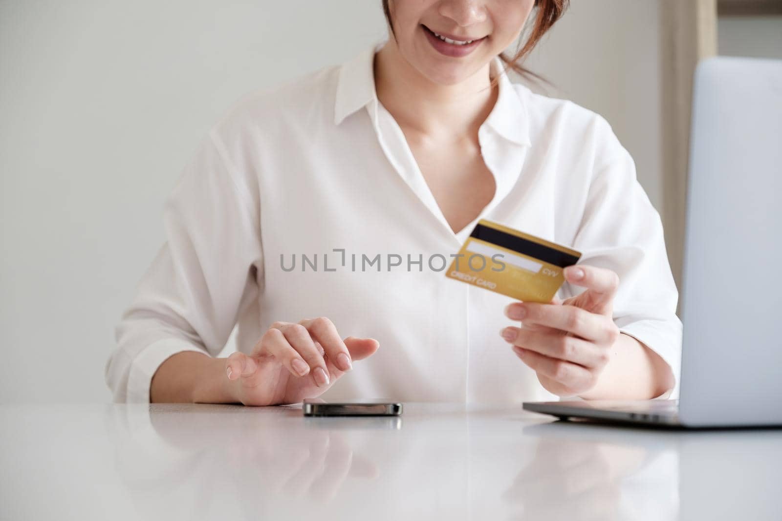 Woman using online banking to paying credit card bill. online payment concept. by itchaznong