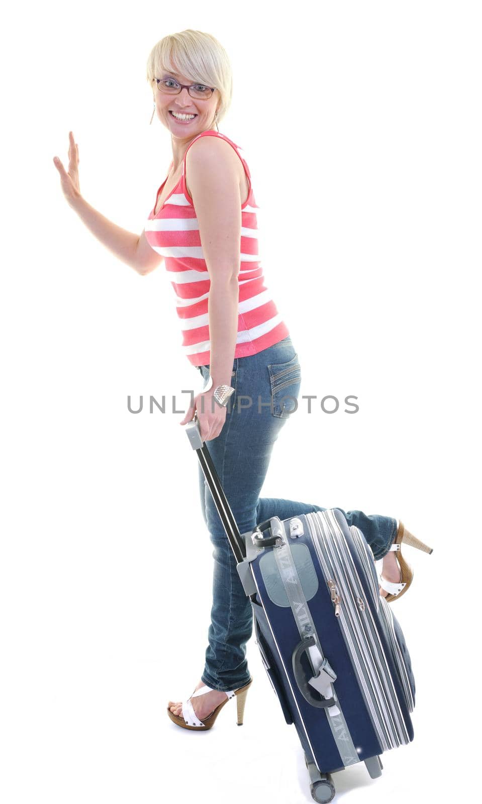 woman tourist packing travel bag isolated on white backgound in studio