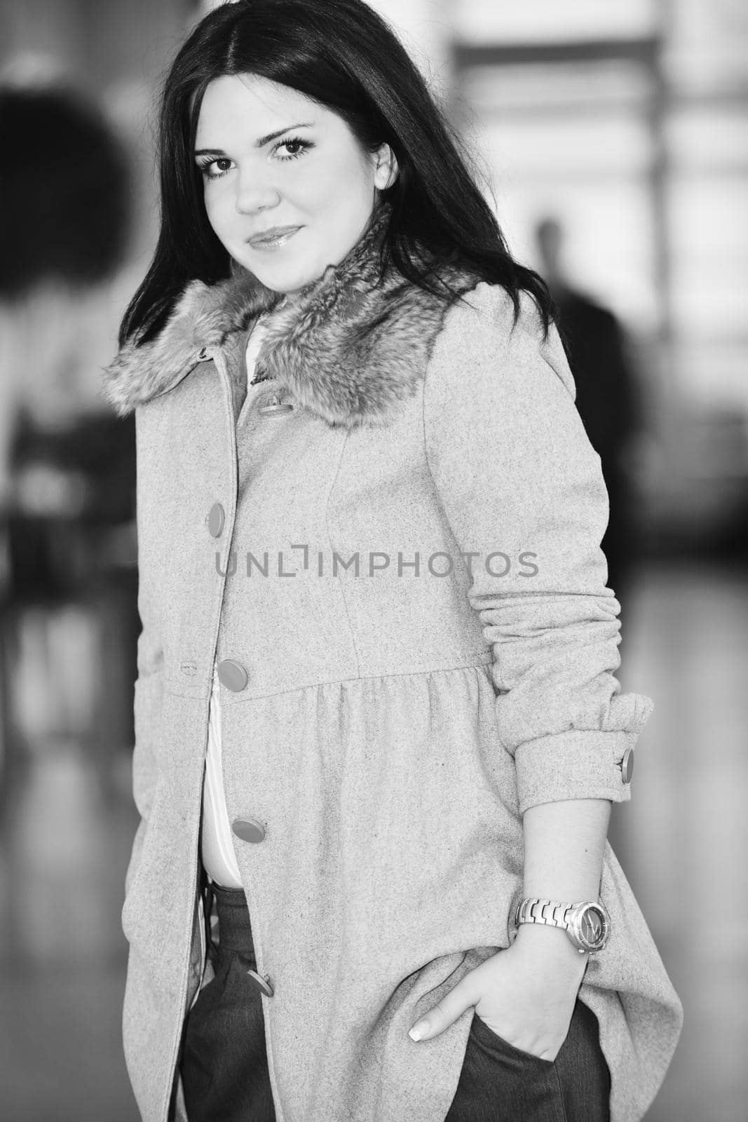young happy business woman or student posing in fashionable clothes indoor in bright building 