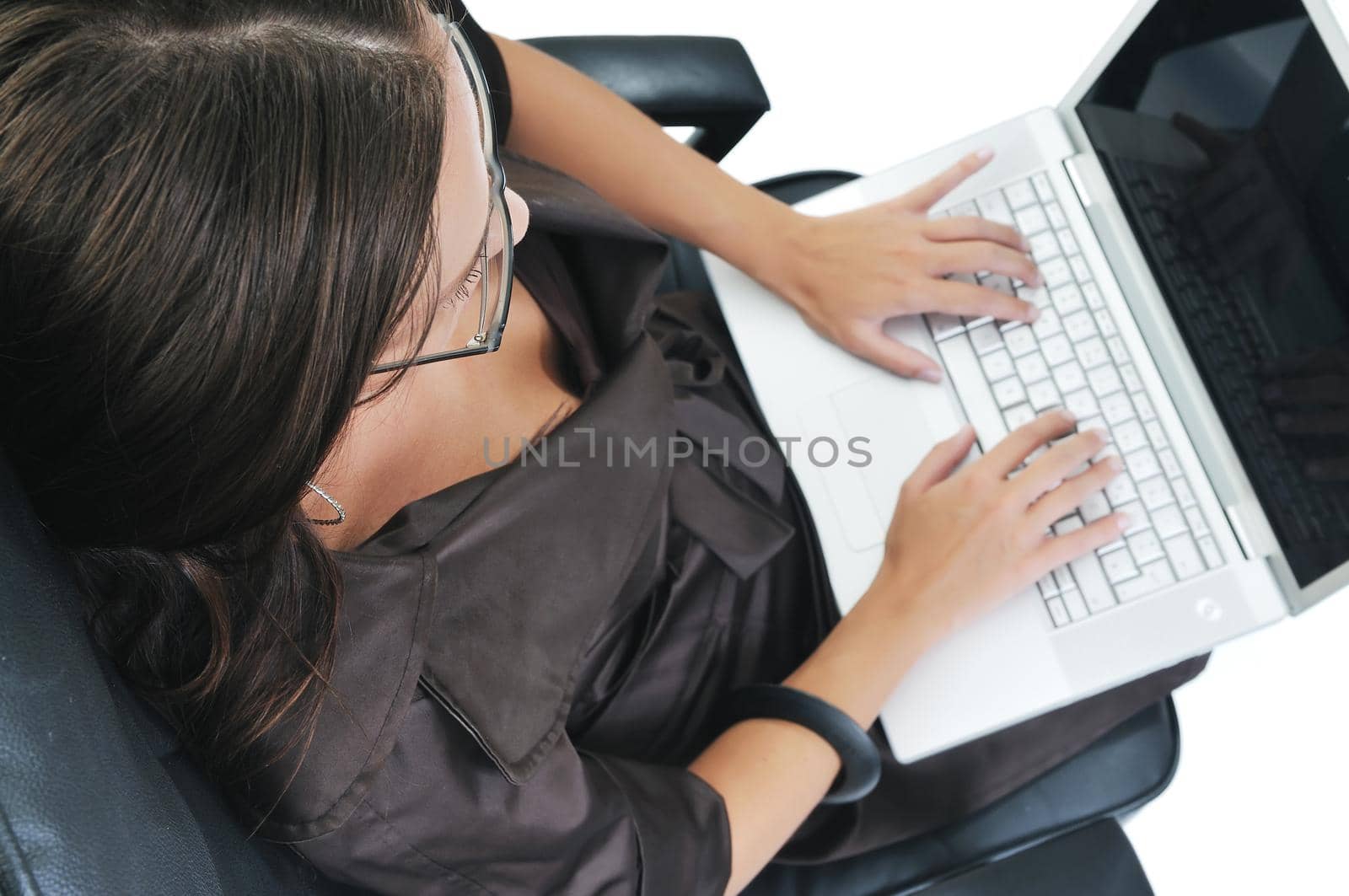 young beautiful business woman isolated on white workling on laptop computer