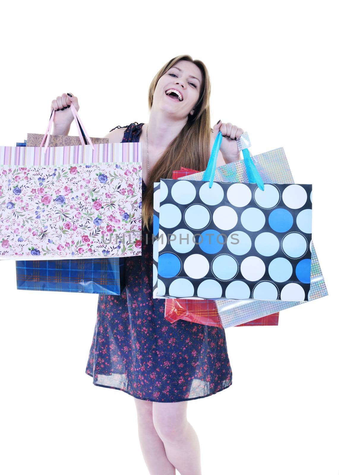 happy young adult women  shopping with colored bags  isolated over white background in studio