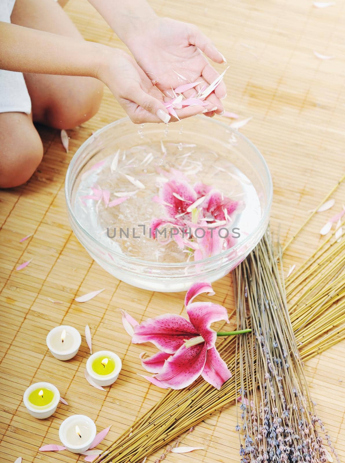 hand spa and beauty treatment with aroma and flowers in water