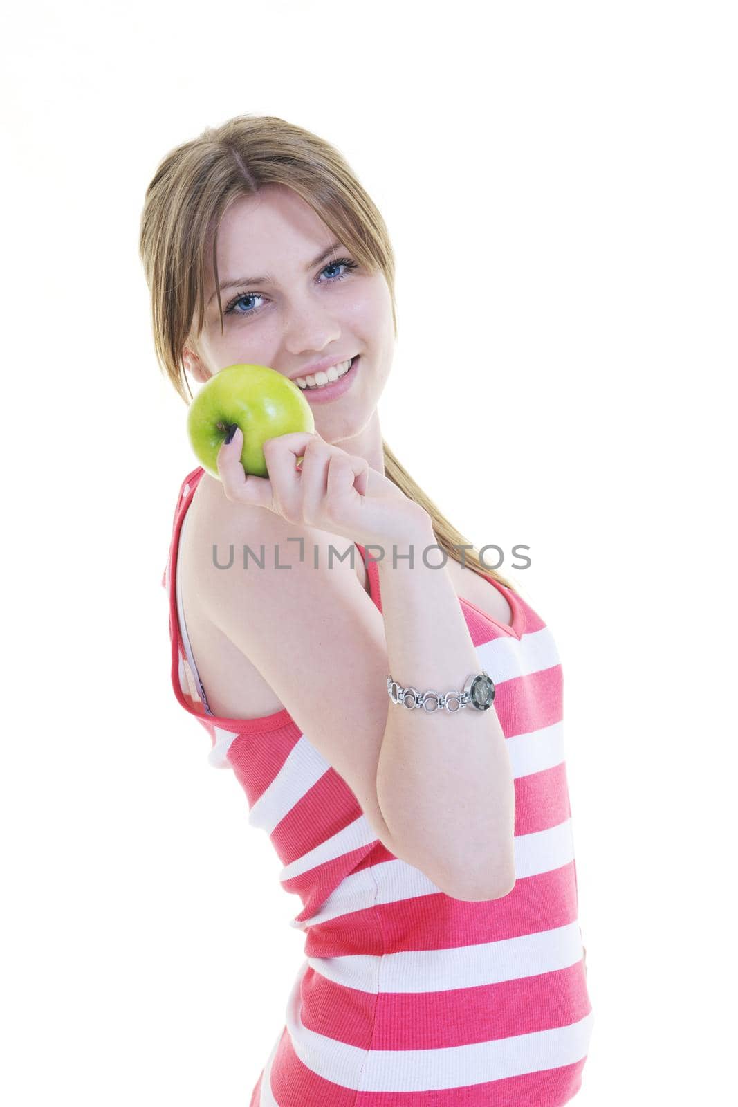 happy young woman eat green apple isolated  on white backround in studio