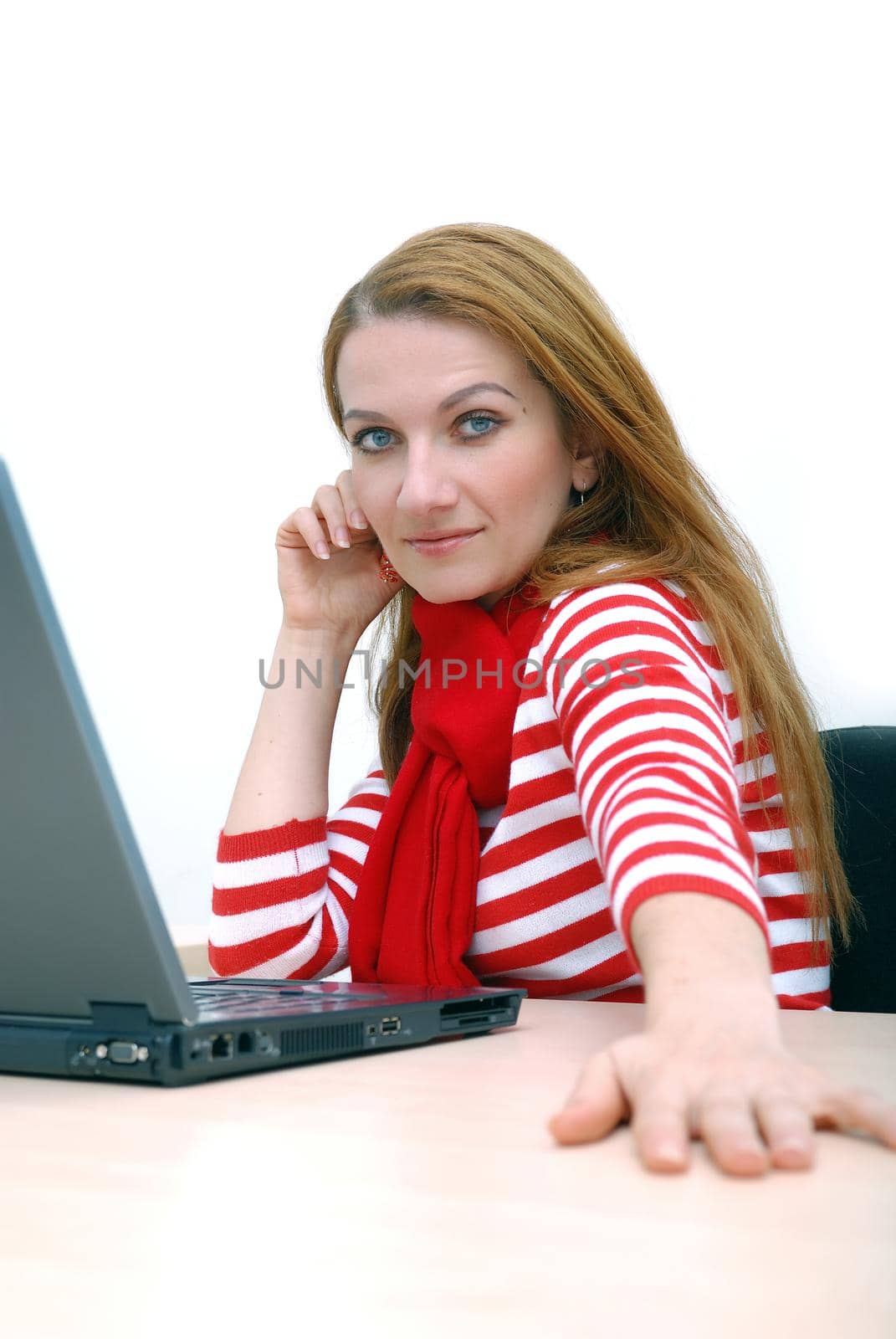 woman in red working on laptop at bright  office