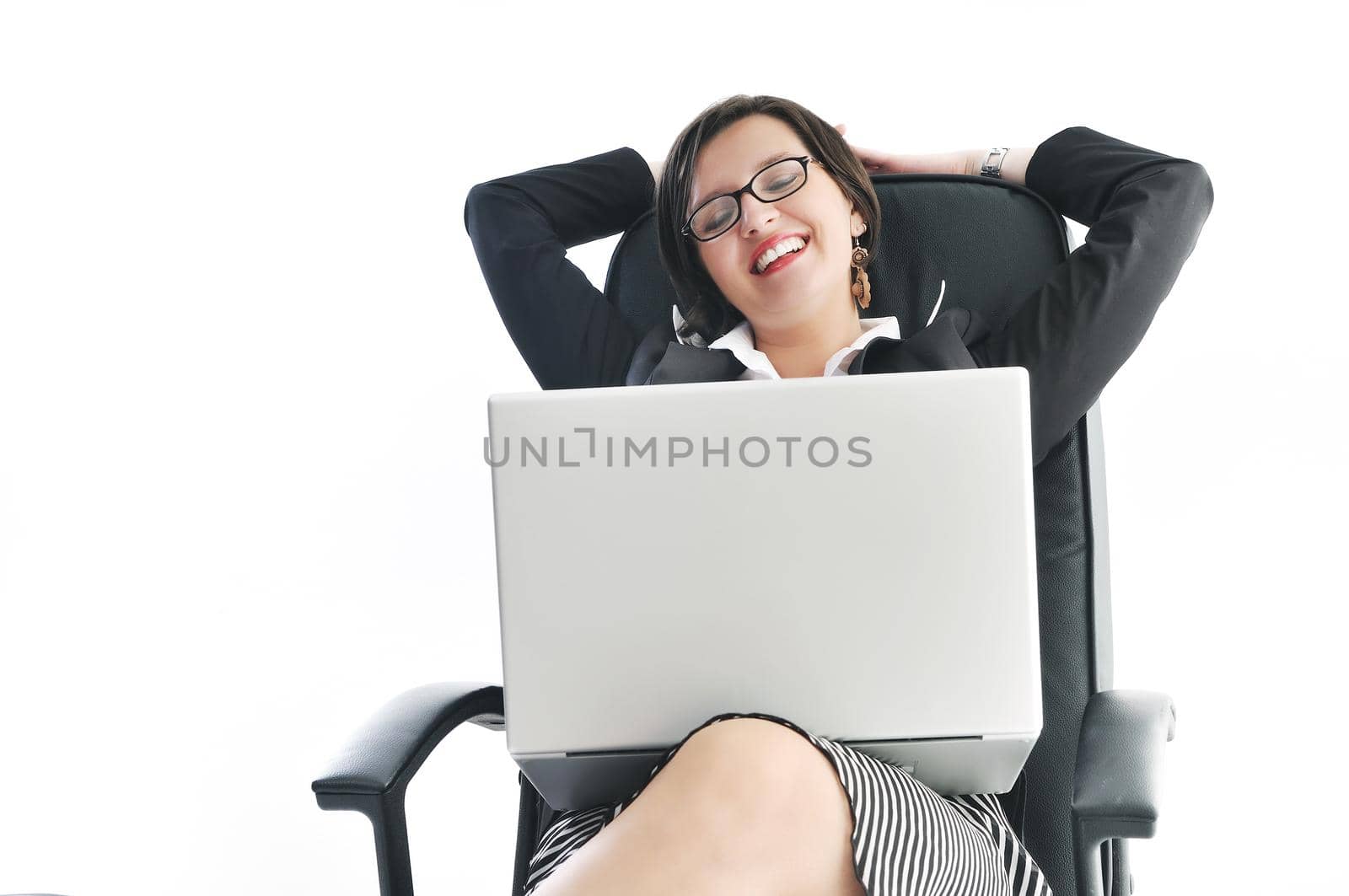 young beautiful business woman isolated on white workling on laptop computer