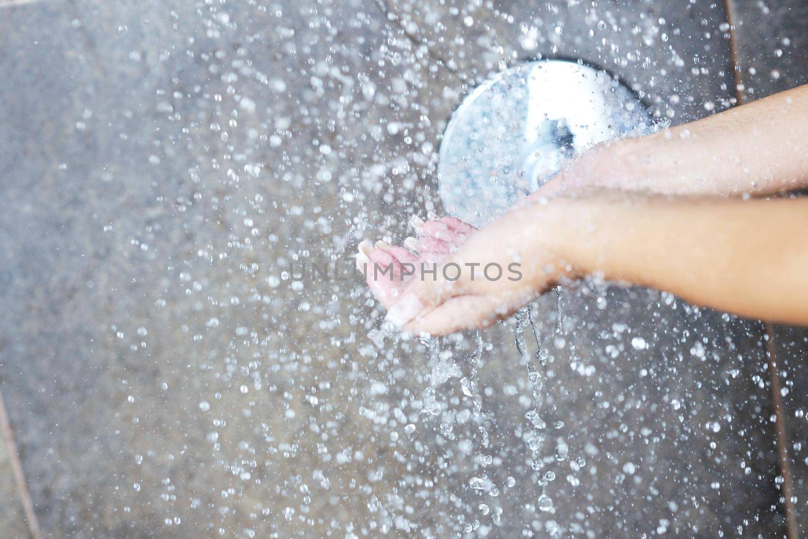 Portrait of a sexy young woman enjoing bath under water shower