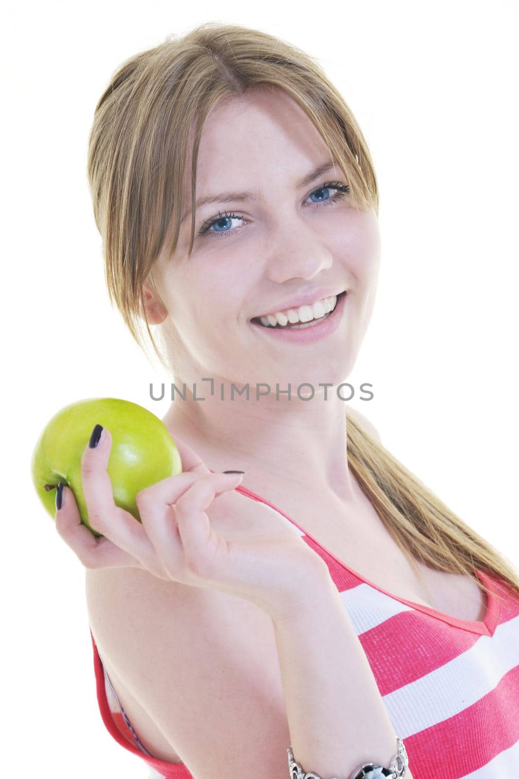 happy young woman eat green apple isolated  on white backround in studio