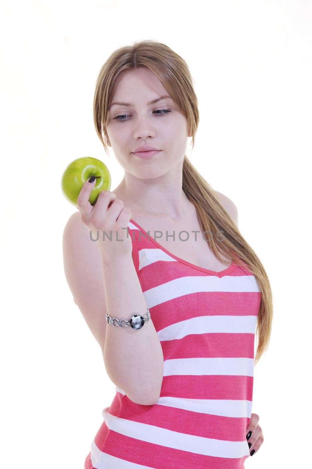 happy young woman eat green apple isolated  on white backround in studio