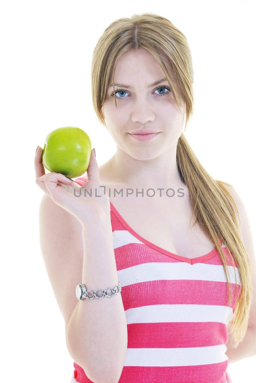 happy young woman eat green apple isolated  on white backround in studio