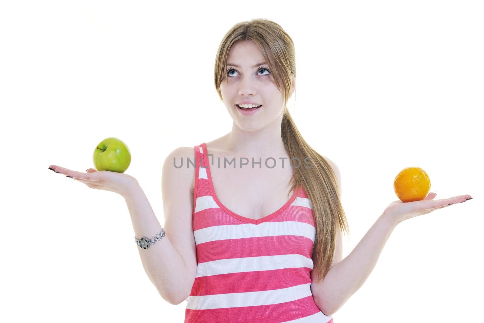 woman eat green apple isolated  on white backround in studio representing healthy lifestile and eco food concept