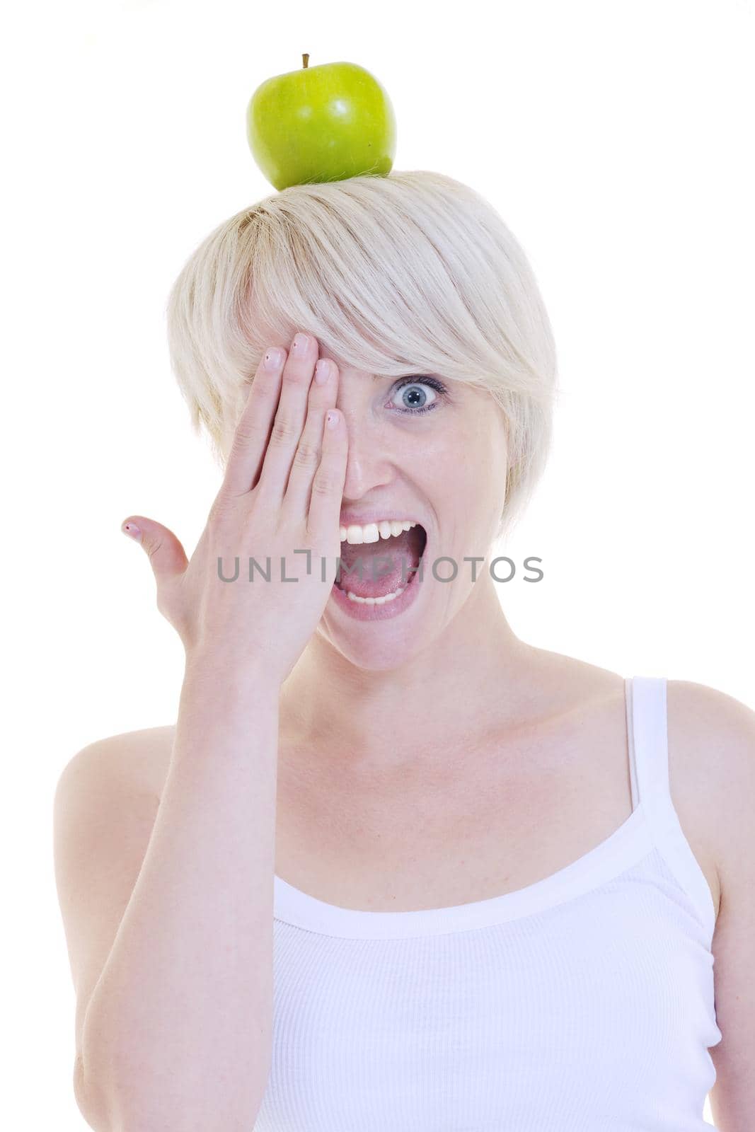happy young woman eat green apple isolated  on white backround in studio