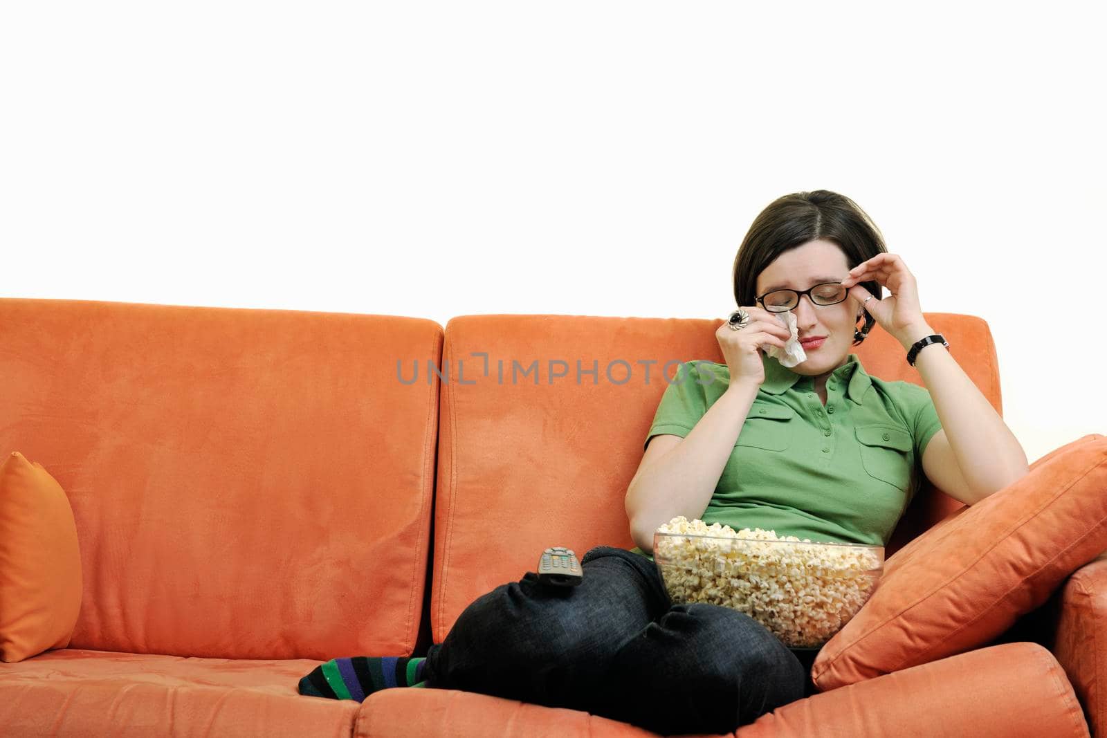 young woman eat popcorn, watching movies and eat popcor isolated on white