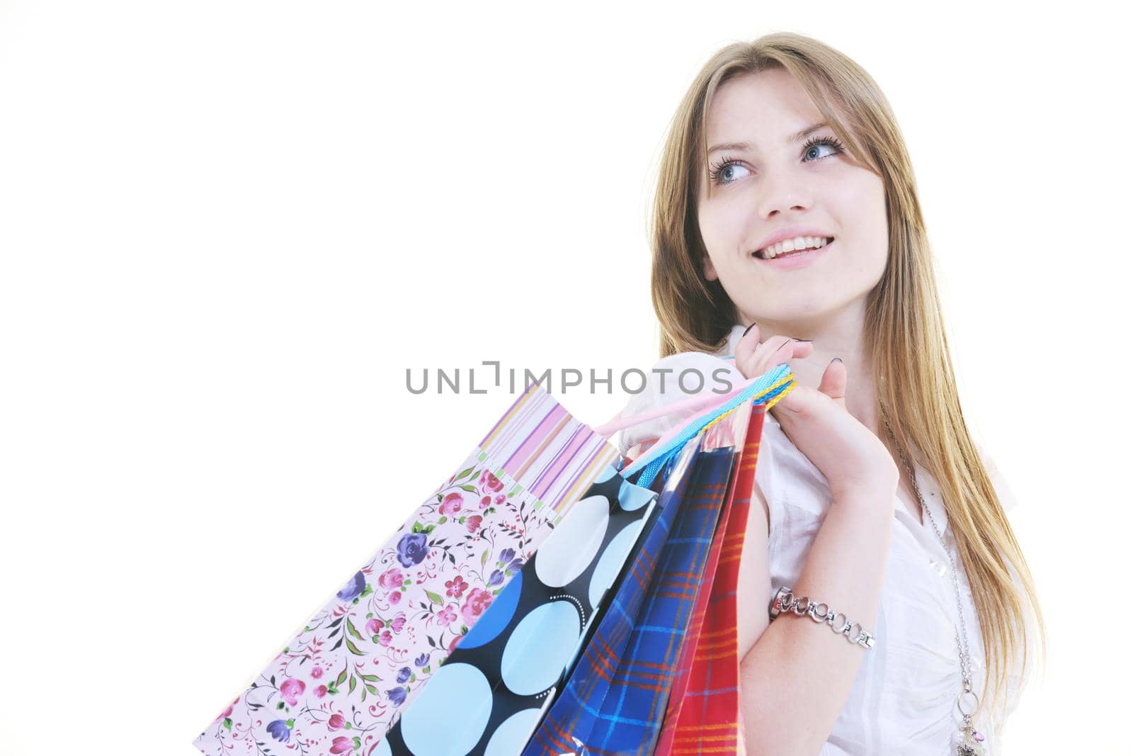 happy young adult women  shopping with colored bags  isolated over white background in studio