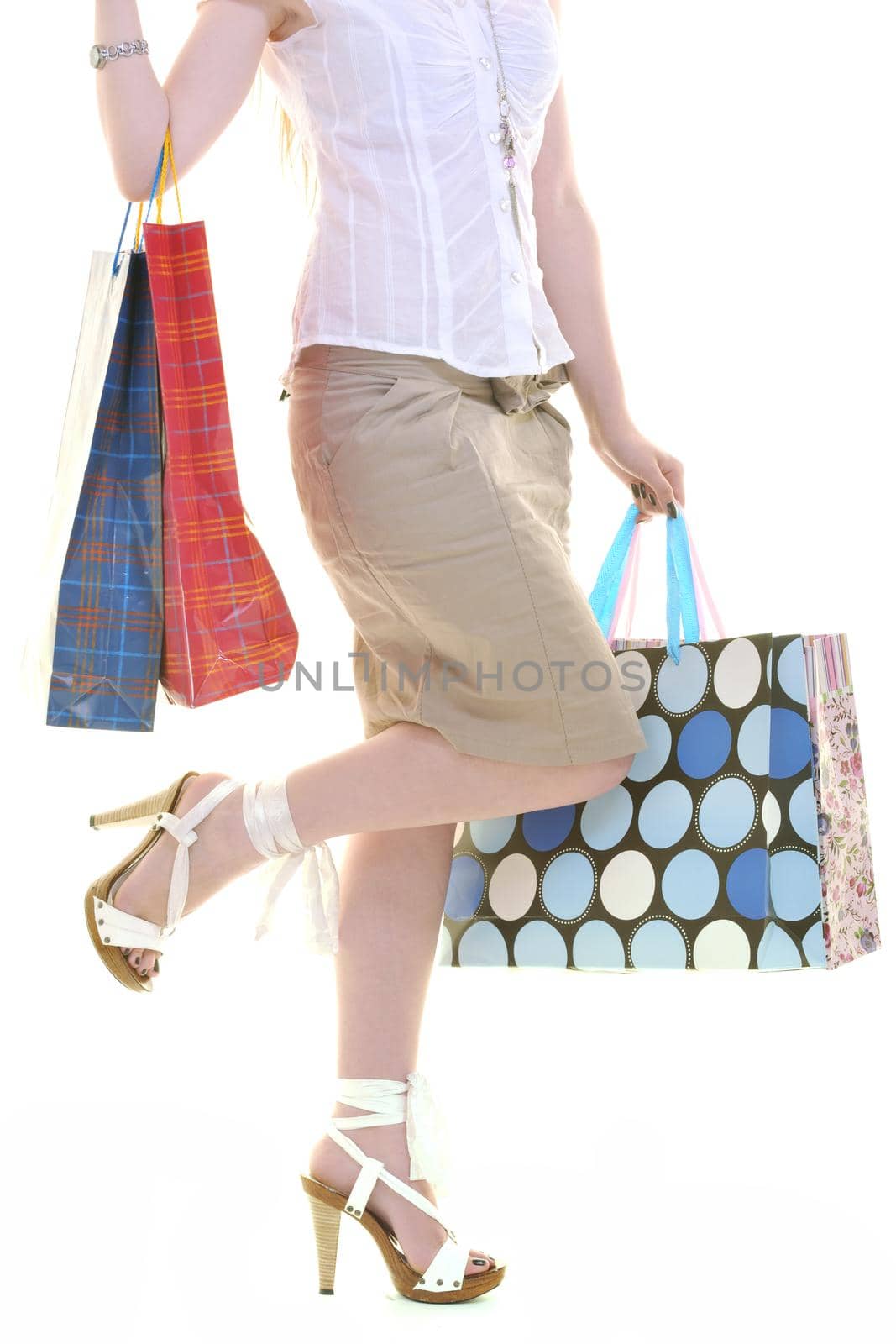 happy young adult women  shopping with colored bags  isolated over white background in studio