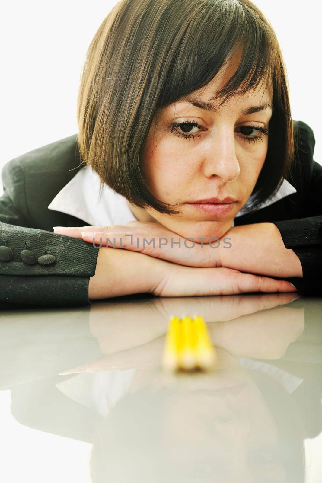 young business woman choosing right yellow pencil and representing concept of perfection and order