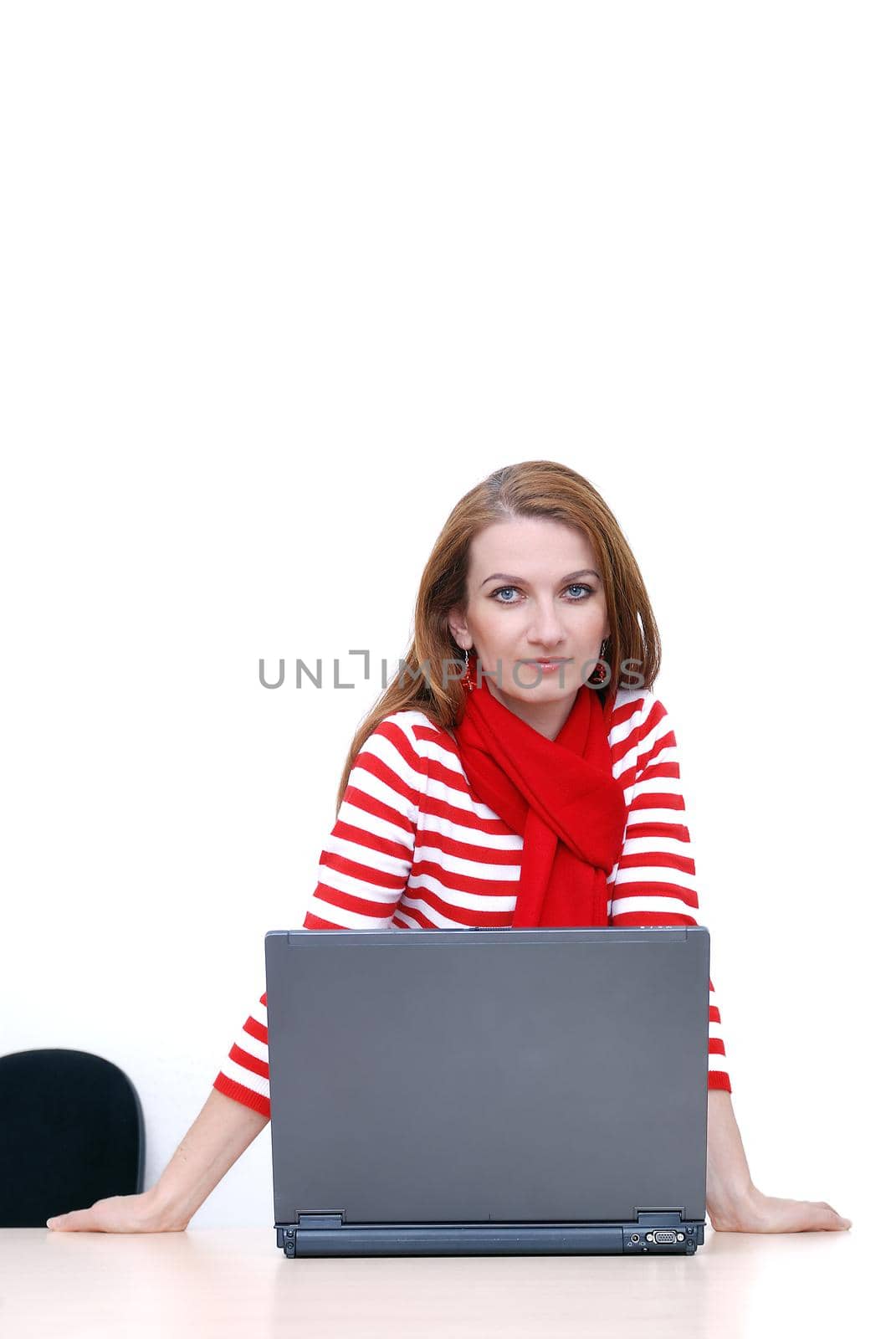 woman in red working on laptop at bright  office