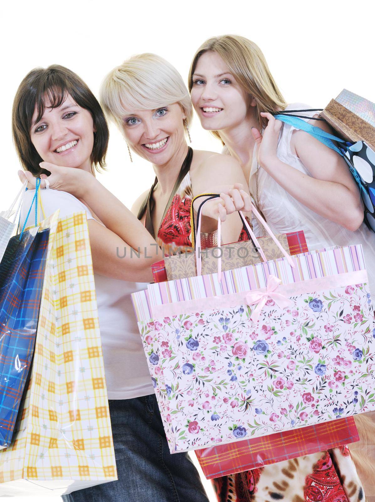 women shopping concept with young lady and colored bags  isolated over white background in studio