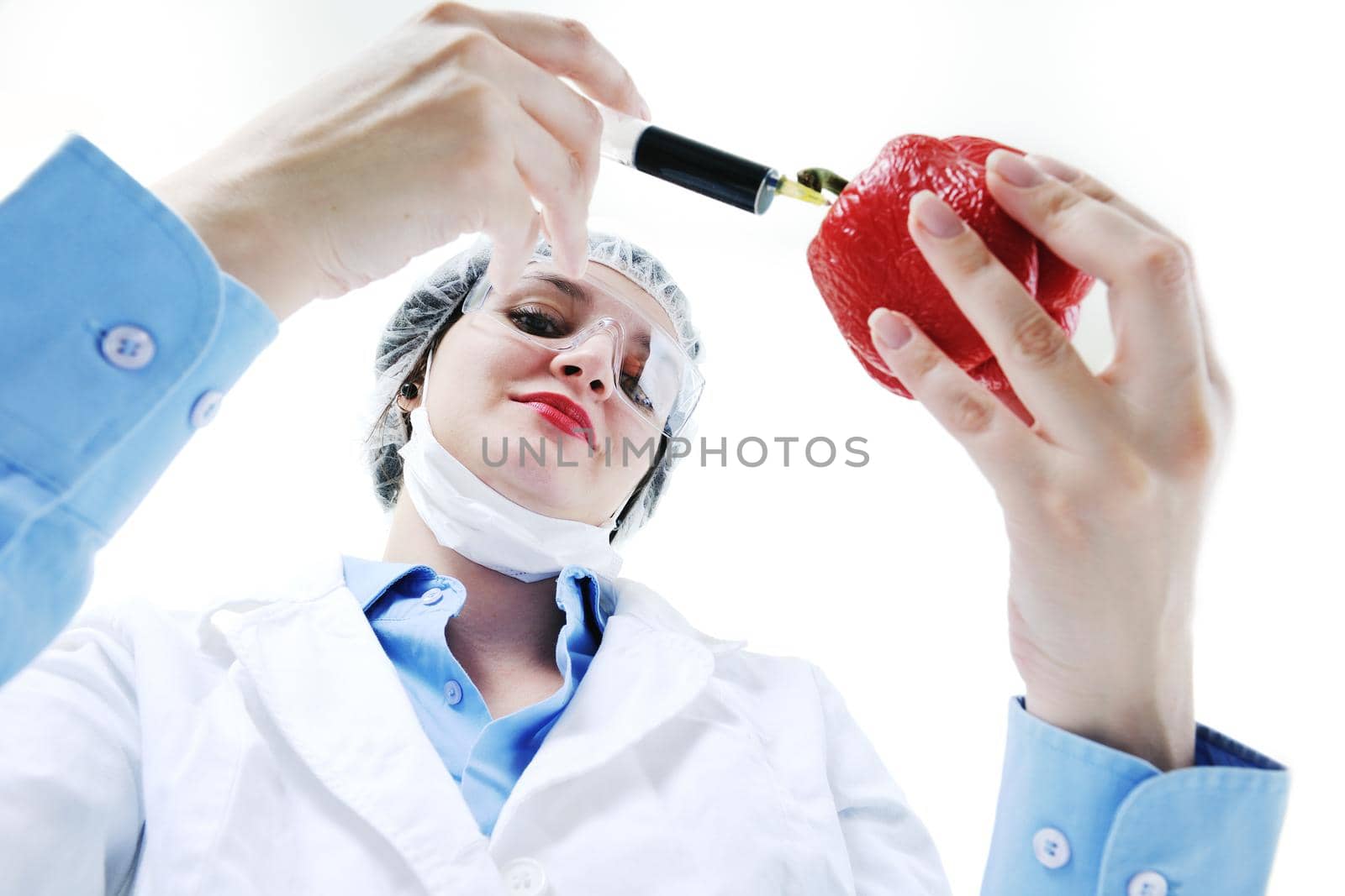 isolated on white young nurse doctor woman with red vegetable food papper representing bio food concept 
