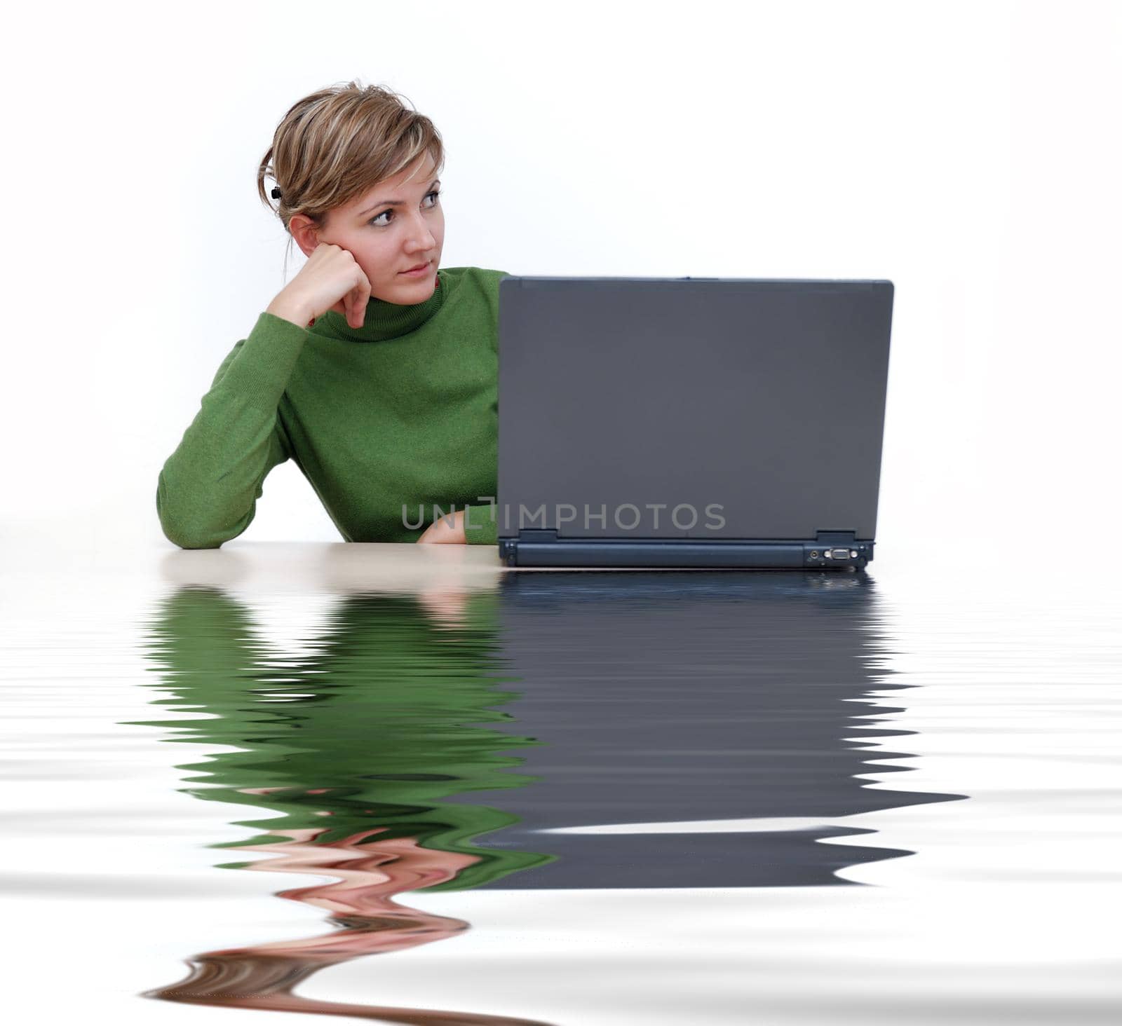 businesswoman in green with laptop