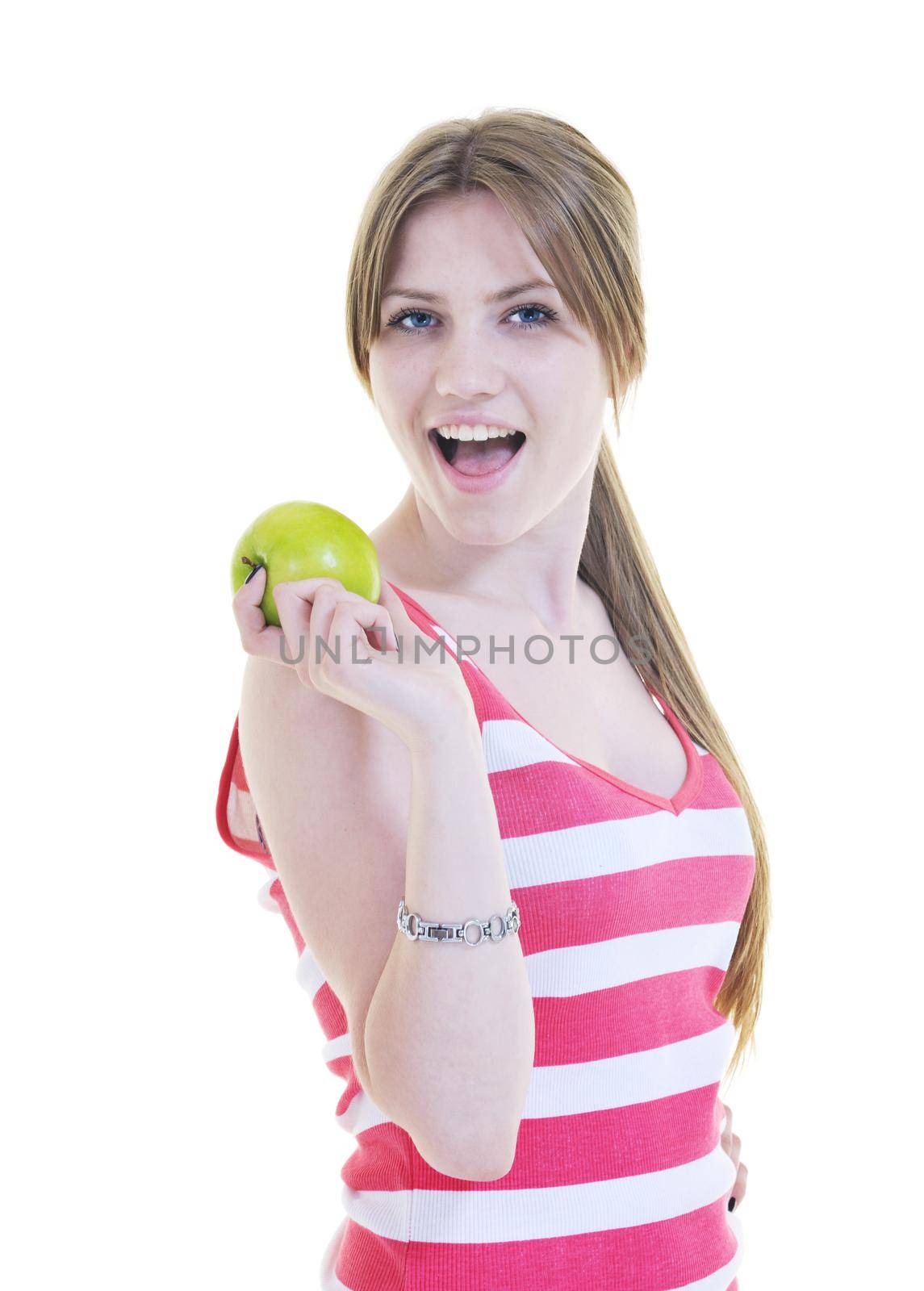 happy young woman eat green apple isolated  on white backround in studio