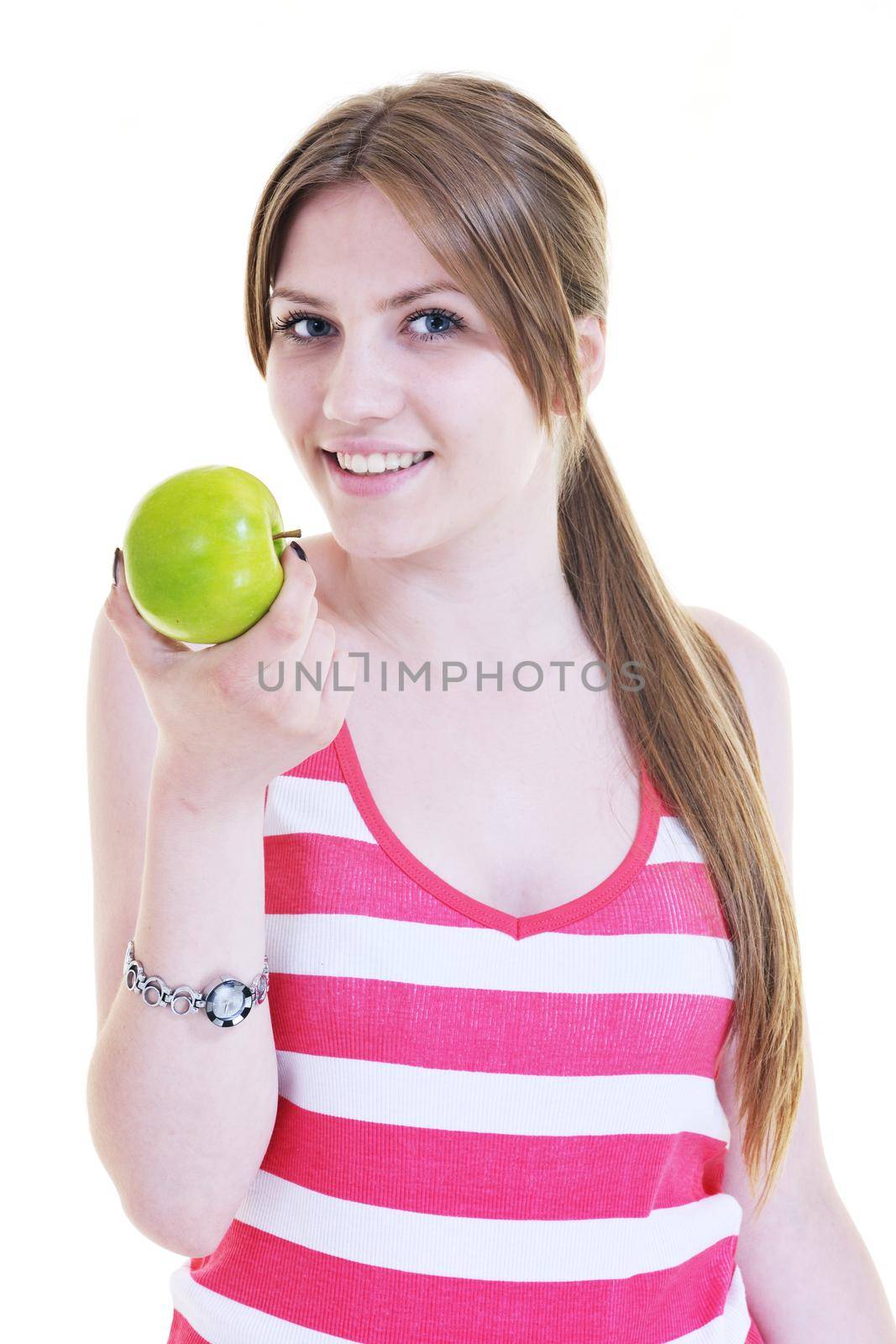 happy young woman eat green apple isolated  on white backround in studio