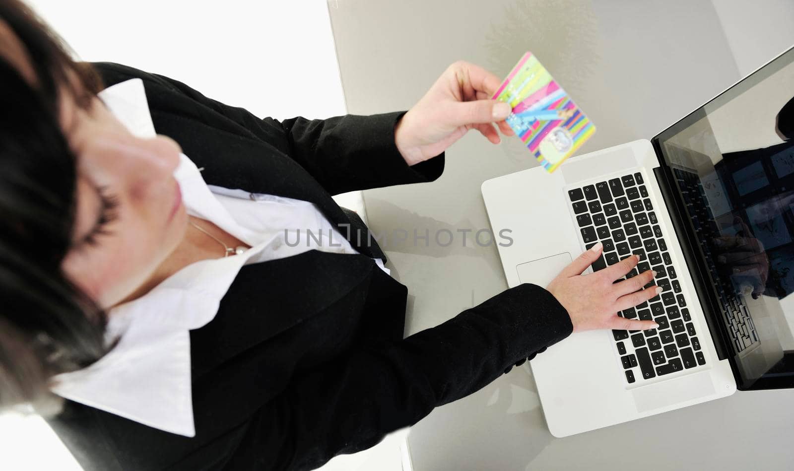 young business woman making online payment with credit card and representing concept of new age in banking and plastic money