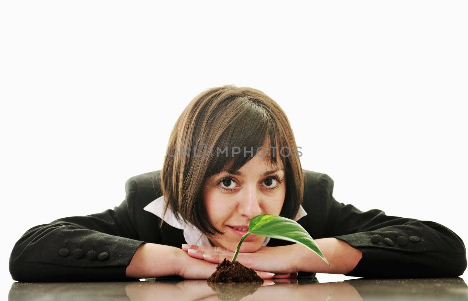 young business woman isolated on white holding green plant with small leaf and waiting to grow