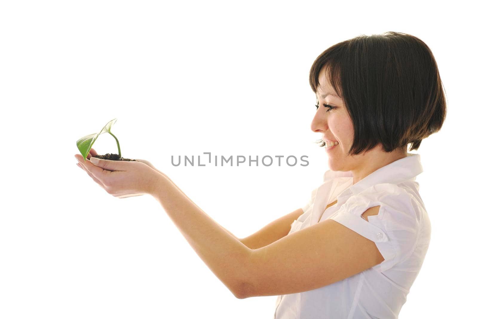 young business woman isolated on white holding green plant with small leaf and waiting to grow