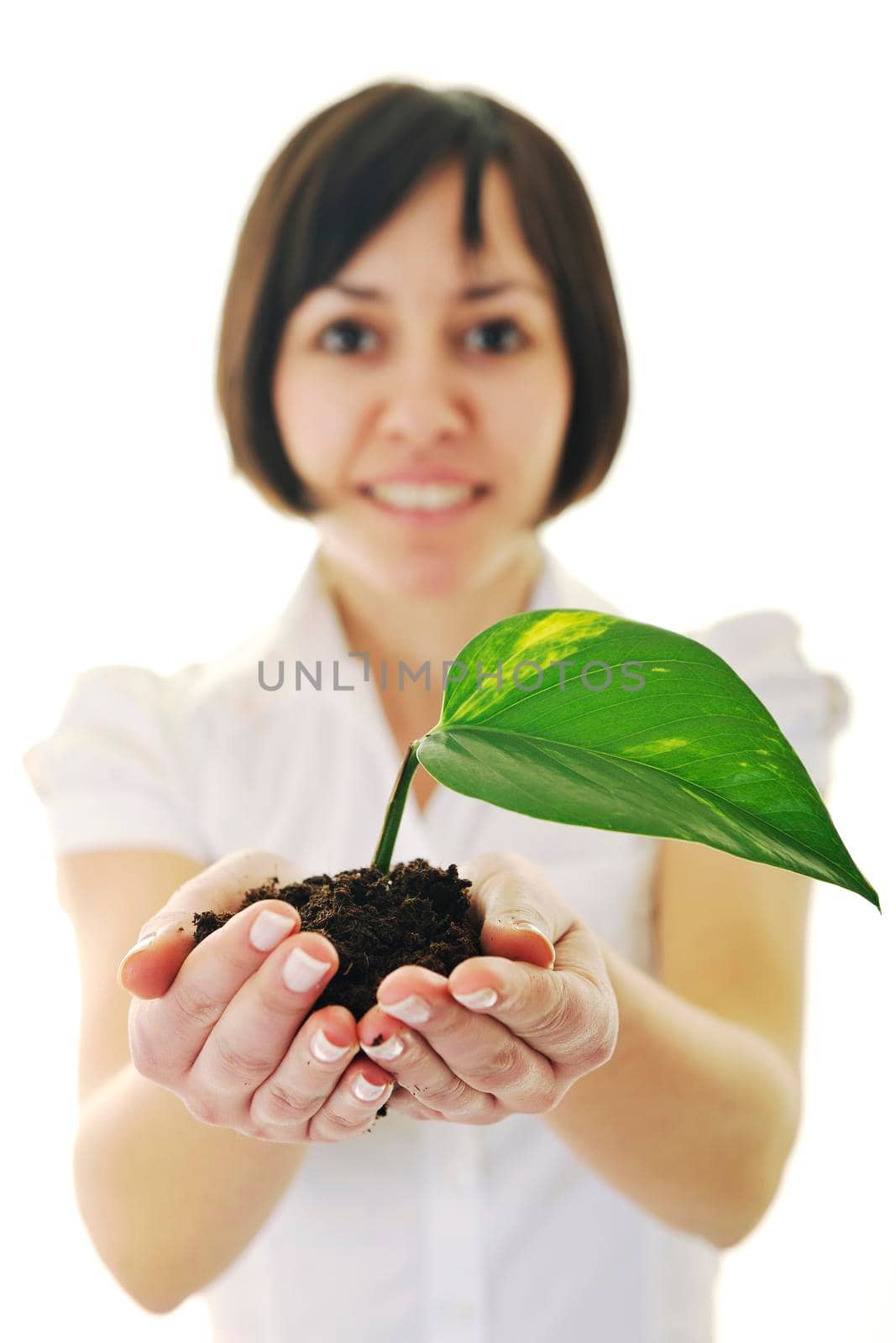 young business woman isolated on white holding green plant with small leaf and waiting to grow