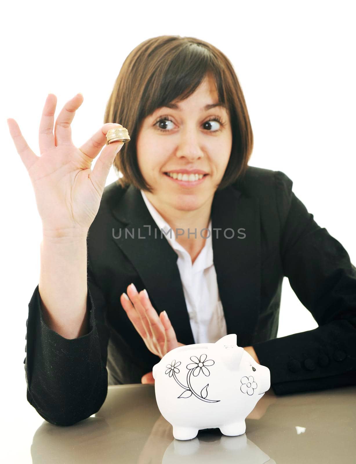 business woman putting coins money in piggy bank by dotshock