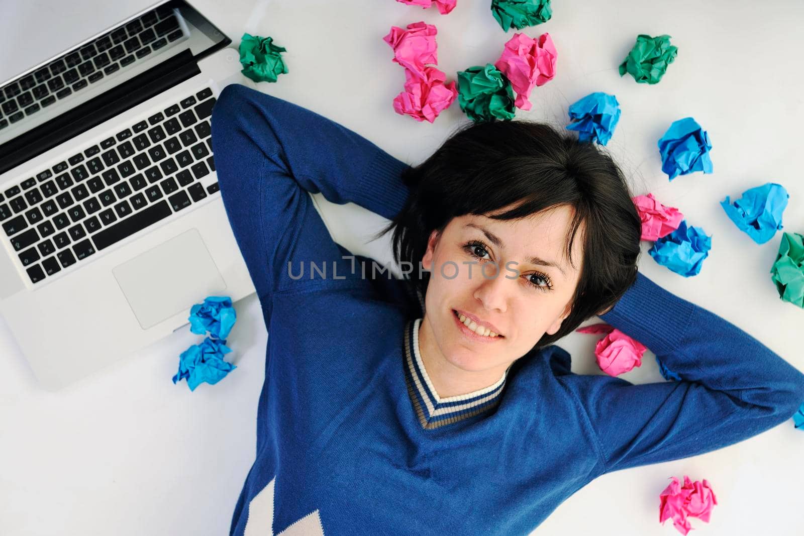 young beautiful brunette student woman working on laptop computer and finding solutions