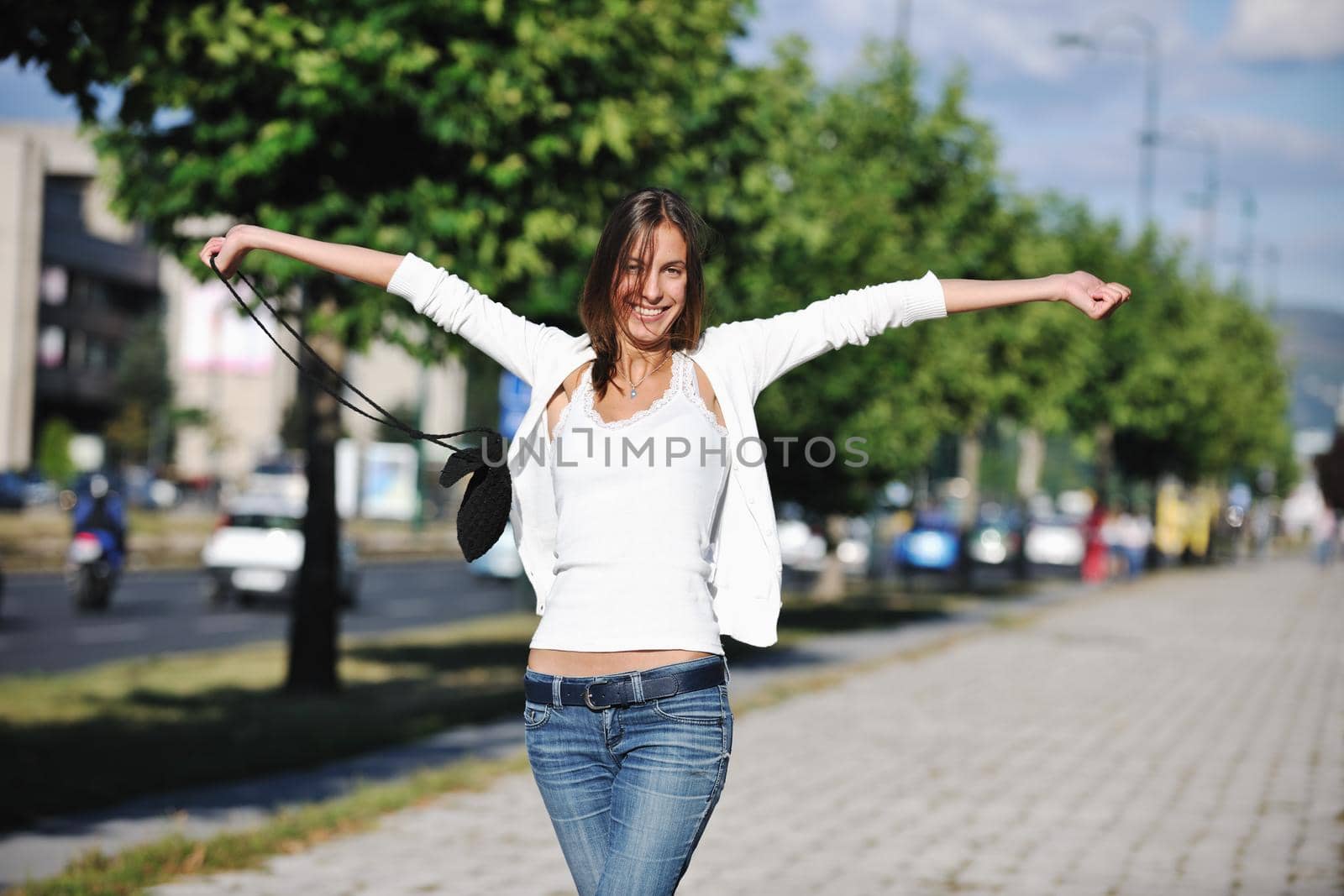 beautiful young woman have fun and relax at city street on beautiful sunny day