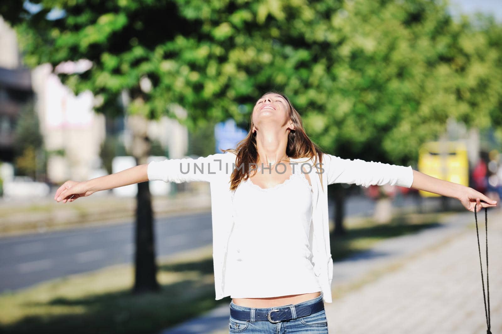 beautiful young woman have fun and relax at city street on beautiful sunny day