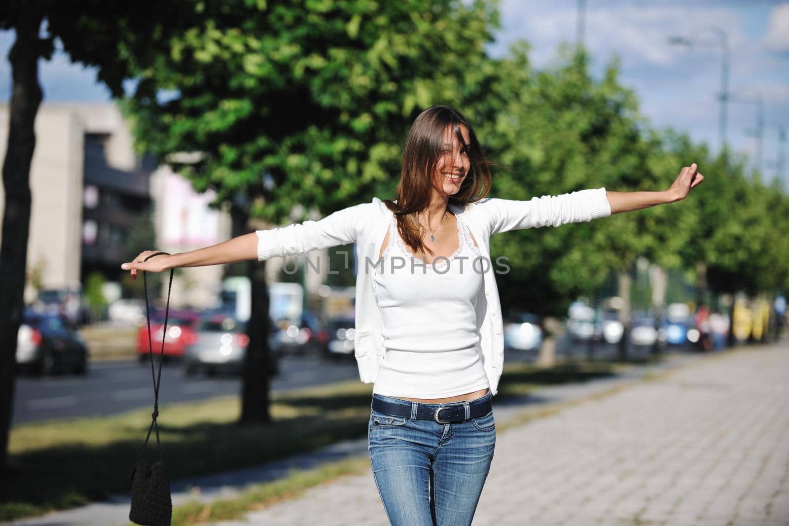 beautiful young woman have fun and relax at city street on beautiful sunny day