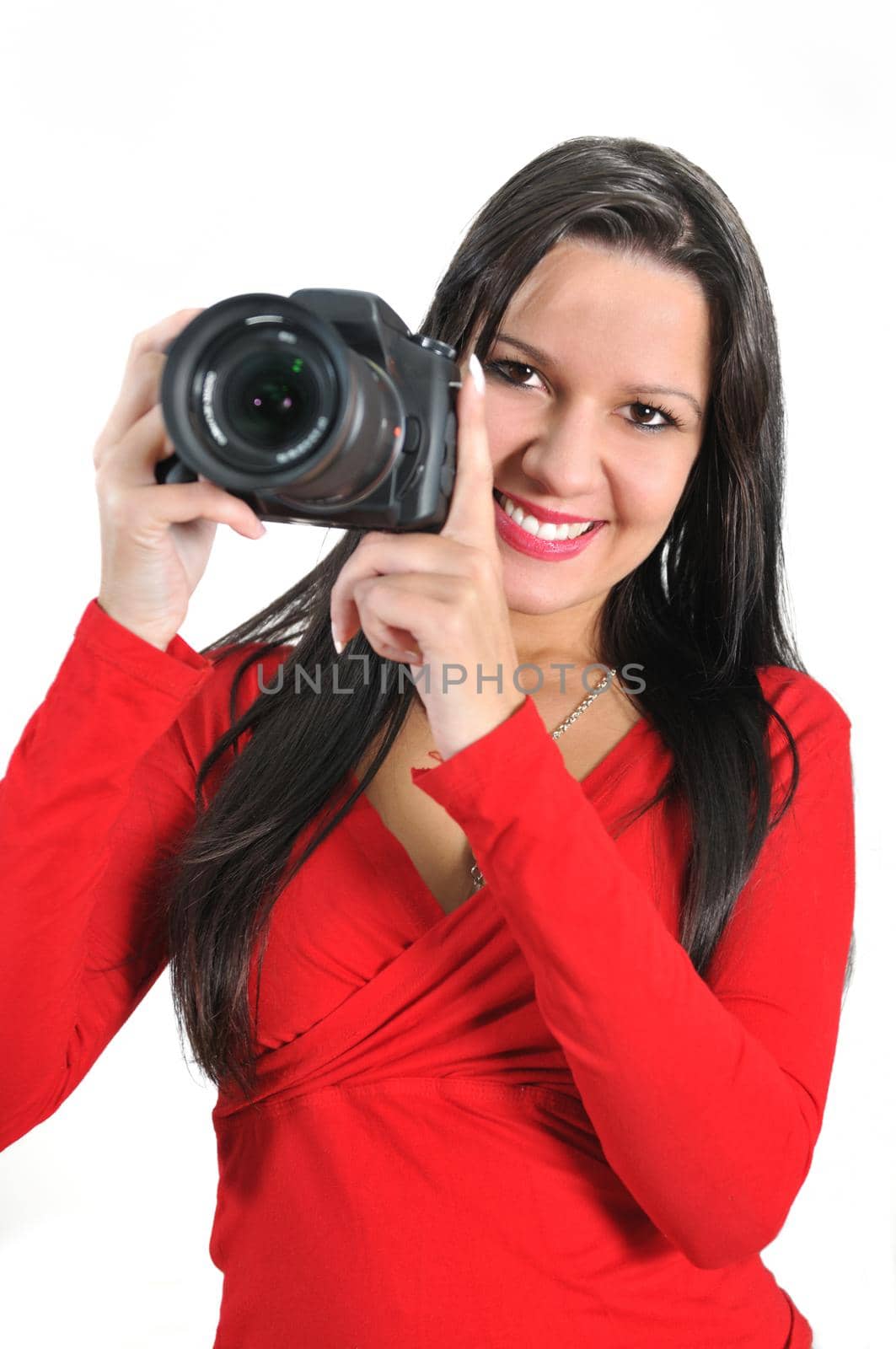 Young woman holding camera in hand taking picture isolated by dotshock