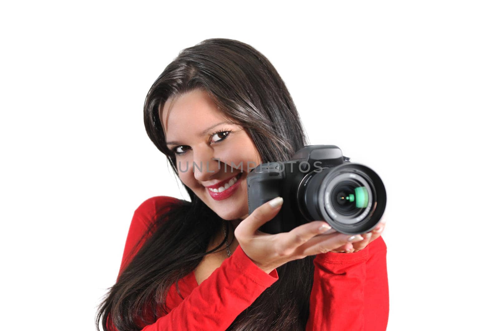 Young woman holding camera in hand taking picture isolated