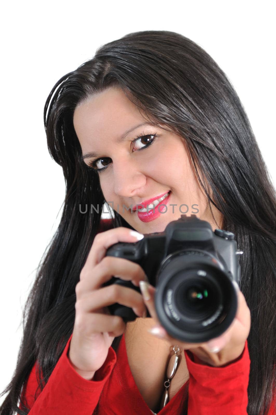 Young woman holding camera in hand taking picture isolated by dotshock