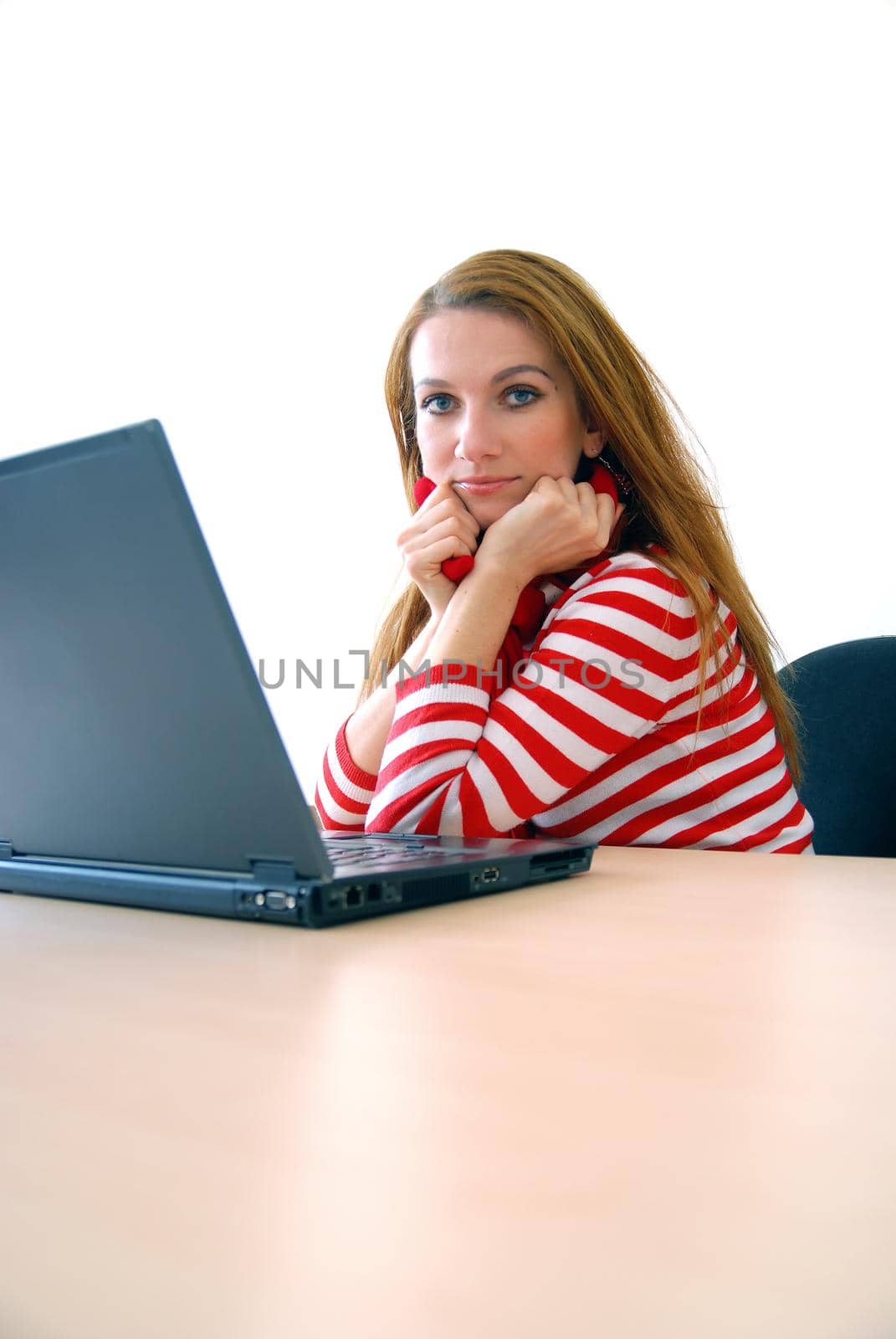 woman in red working on laptop at bright  office