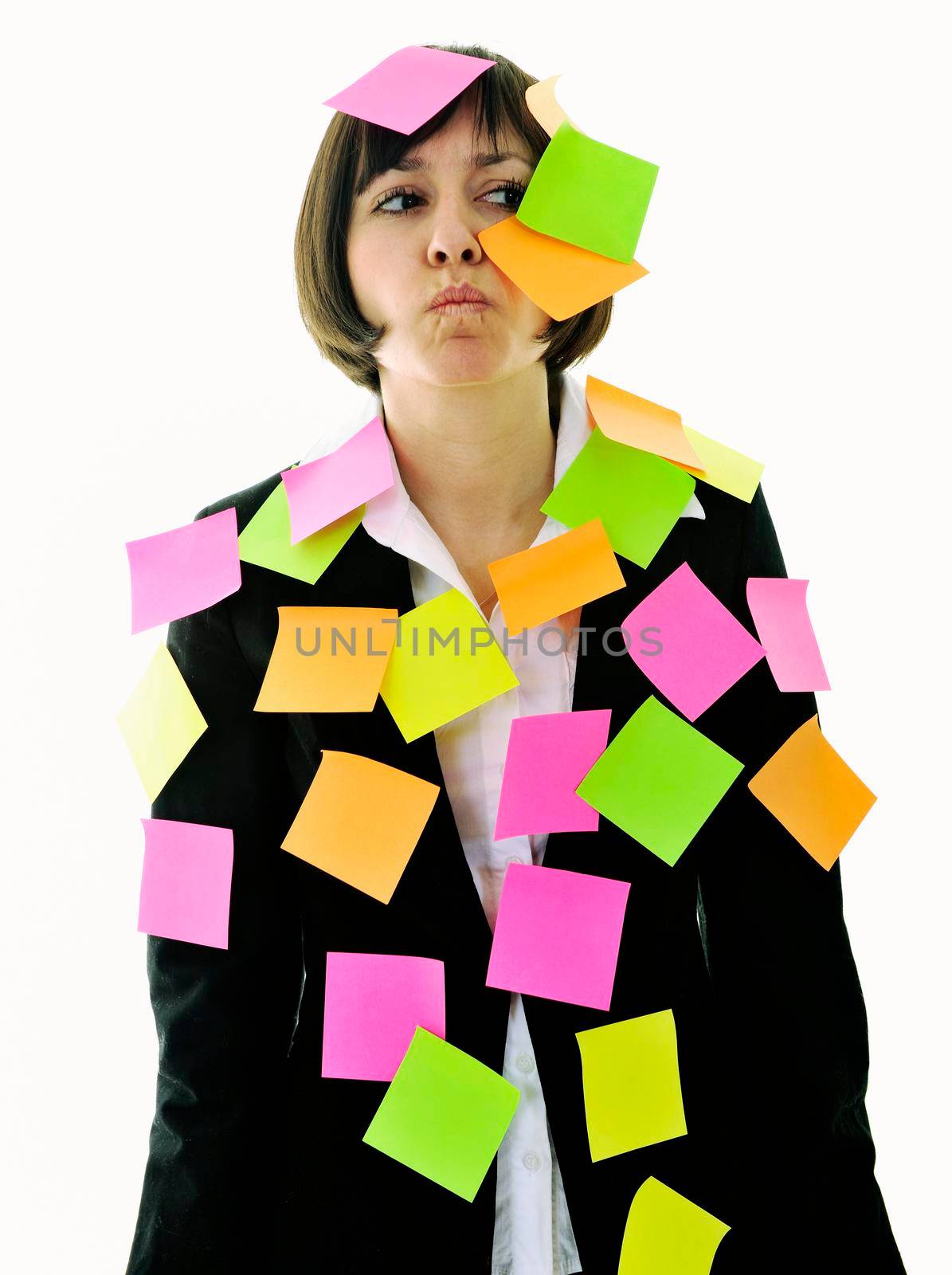 one frustrated young business woman with many of post it representing concept memory and frustration on work