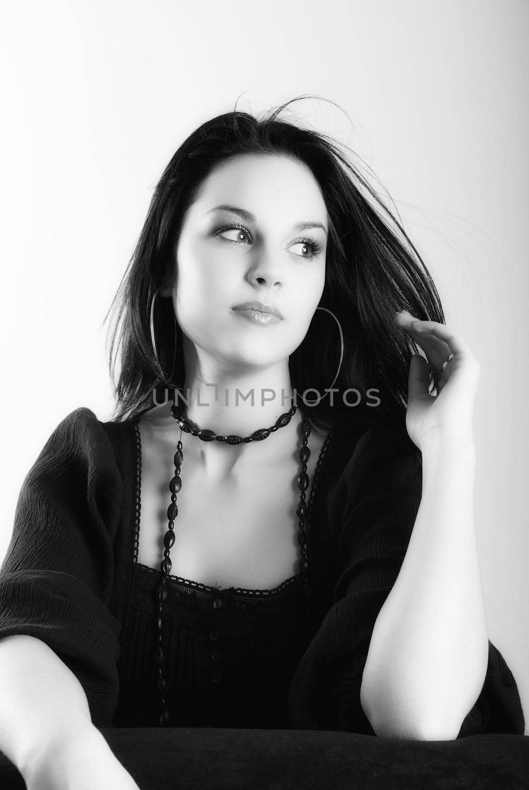 one brunette woman posing in studio 