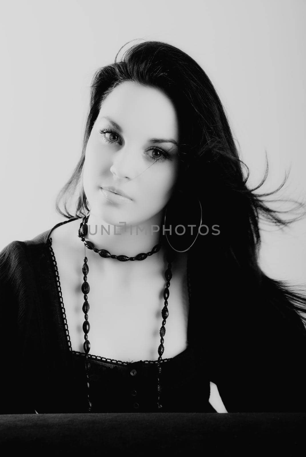 one brunette woman posing in studio 