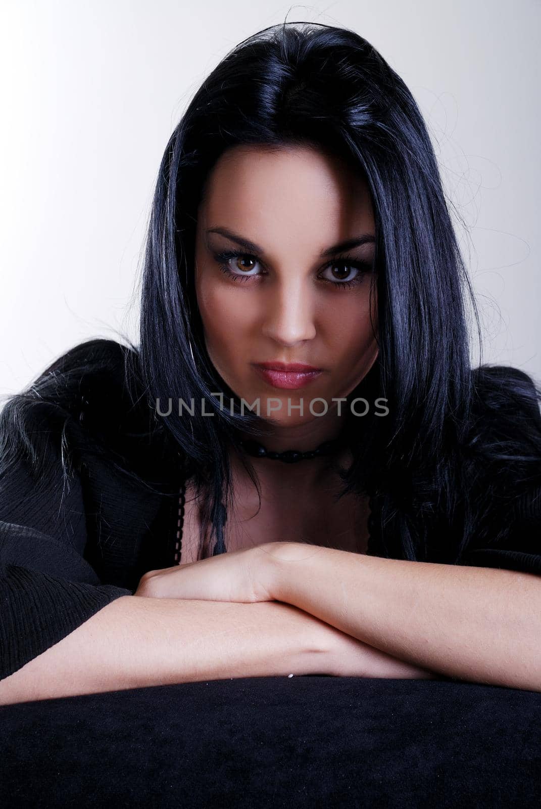 one brunette woman posing in studio 